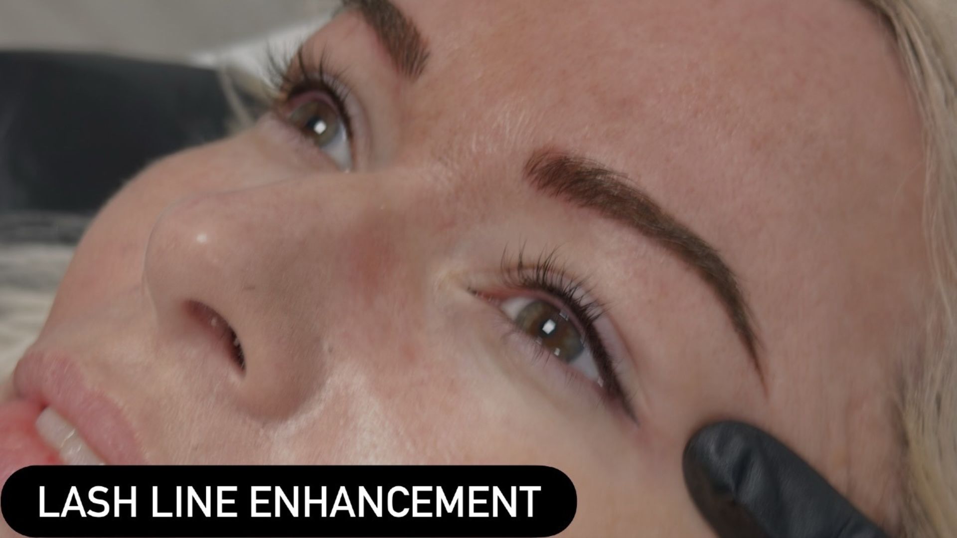 Lash enhancement treatment creating subtle lash line definition for a natural-looking eye enhancement.