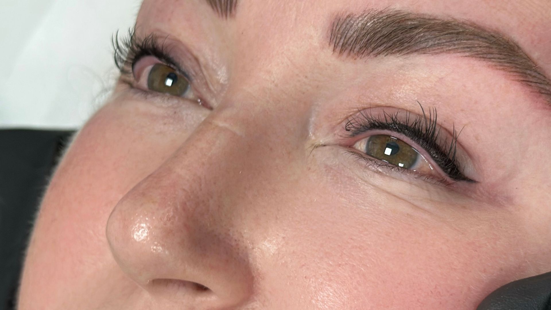 Permanent eyeliner treatment provides defined eye enhancement with long-lasting results.