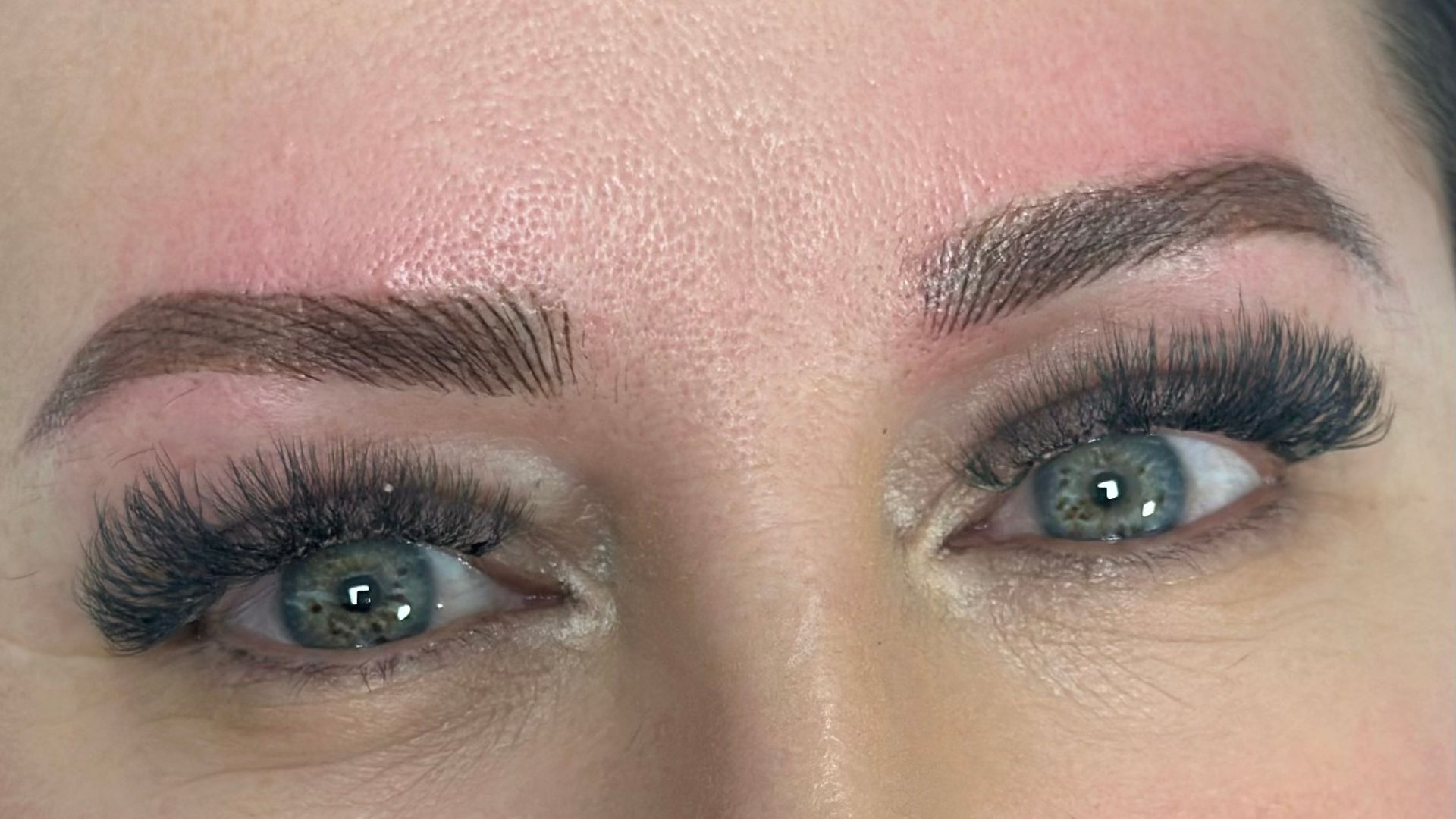 Permanent makeup artist in Romford creating a personalised brow design for natural-looking results.